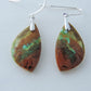 Indonesian Blue Opalized Wood & Sterling Silver Earrings  Extremely rare and lovely, Indonesian Blue Opalized Wood is a cherished material used by lapidary artists for creating stunning pieces of jewelry.  The material was first found as pebbles and rounded stones in streams and near the slopes of three volcanoes in the West Java Province