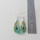 Extremely rare and lovely, Indonesian Blue Opalized Wood is a cherished material used by lapidary artists for creating stunning pieces of jewelry.  The material was first found as pebbles and rounded stones in streams and near the slopes of three volcanoes in the West Java Province. Indonesian Blue Opalized Wood Earrings with Sterling Silver.