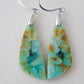 Indonesian Blue Opalized Wood Earrings with Sterling Silver. Extremely rare and lovely, Indonesian Blue Opalized Wood is a cherished material used by lapidary artists for creating stunning pieces of jewelry.  The material was first found as pebbles and rounded stones in streams and near the slopes of three volcanoes in the West Java Province.  