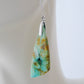 Indonesian Blue Opalized Wood Earrings with Sterling Silver. Extremely rare and lovely, Indonesian Blue Opalized Wood is a cherished material used by lapidary artists for creating stunning pieces of jewelry.  The material was first found as pebbles and rounded stones in streams and near the slopes of three volcanoes in the West Java Province. 