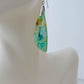 Indonesian Blue Opalized Wood Earrings with Sterling Silver, ready to uplift your earring collection.  Extremely rare and lovely, Indonesian Blue Opalized Wood is a cherished material used by lapidary artists for creating stunning pieces of jewelry.  The material was first found as pebbles and rounded stones in streams and near the slopes of three volcanoes in the West Java Province.