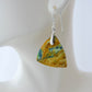 Extremely rare and lovely, Indonesian Blue Opalized Wood is a cherished material used by lapidary artists for creating stunning pieces of jewelry.  The material was first found as pebbles and rounded stones in streams and near the slopes of three volcanoes in the West Java Province.  The bail and earring wires are authentic 925 sterling silver. Indonesian Blue Opalized Wood Earrings with Sterling Silver, a gorgeous semi-precious gemstone! Feel treasured when you wear these earrings!