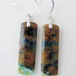 Extremely rare and lovely, Indonesian Blue Opalized Wood is a cherished material used by lapidary artists for creating stunning pieces of jewelry.  The material was first found as pebbles and rounded stones in streams and near the slopes of three volcanoes in the West Java Province.  Indonesian Blue Opalized Wood Earrings with Sterling Silver