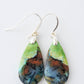 Extremely rare and lovely, Indonesian Blue Opalized Wood is a cherished material used by lapidary artists for creating stunning pieces of jewelry.  The material was first found as pebbles and rounded stones in streams and near the slopes of three volcanoes in the West Java Province.  The bail and earring wires are authentic 925 sterling silver.  Feel treasured when you wear these earrings!
