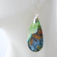 Extremely rare and lovely, Indonesian Blue Opalized Wood is a cherished material used by lapidary artists for creating stunning pieces of jewelry.  The material was first found as pebbles and rounded stones in streams and near the slopes of three volcanoes in the West Java Province.  The bail and earring wires are authentic 925 sterling silver.  Feel treasured when you wear these earrings!
