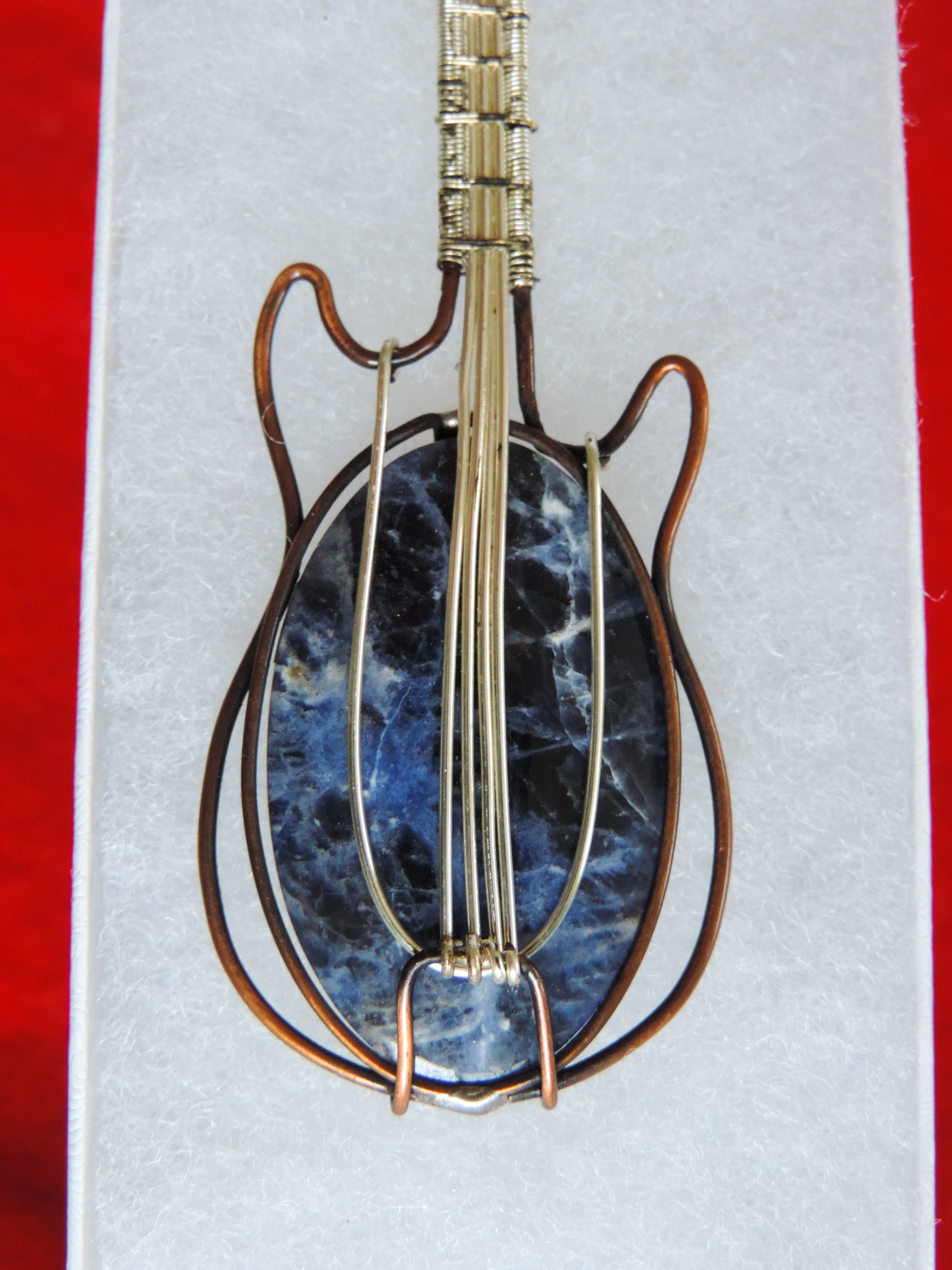 Semi-precious Gemstone and Mixed Metals Guitar Pendant.  Semi-precious Gemstone and Mixed Metals  One of a kind pendant that shows off your unique taste!