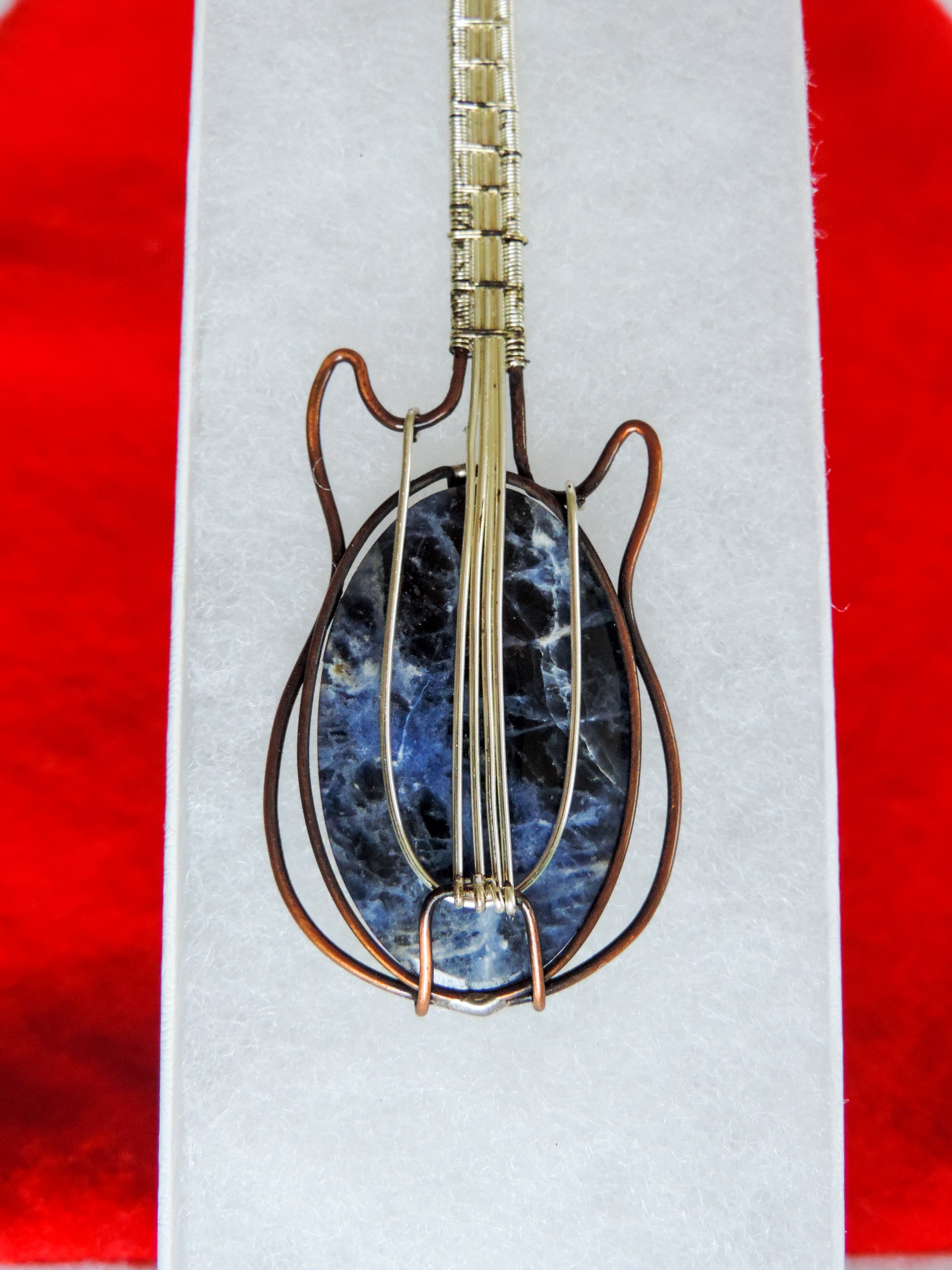 Semi-precious Gemstone and Mixed Metals Guitar Pendant.  Semi-precious Gemstone and Mixed Metals  One of a kind pendant that shows off your unique taste!