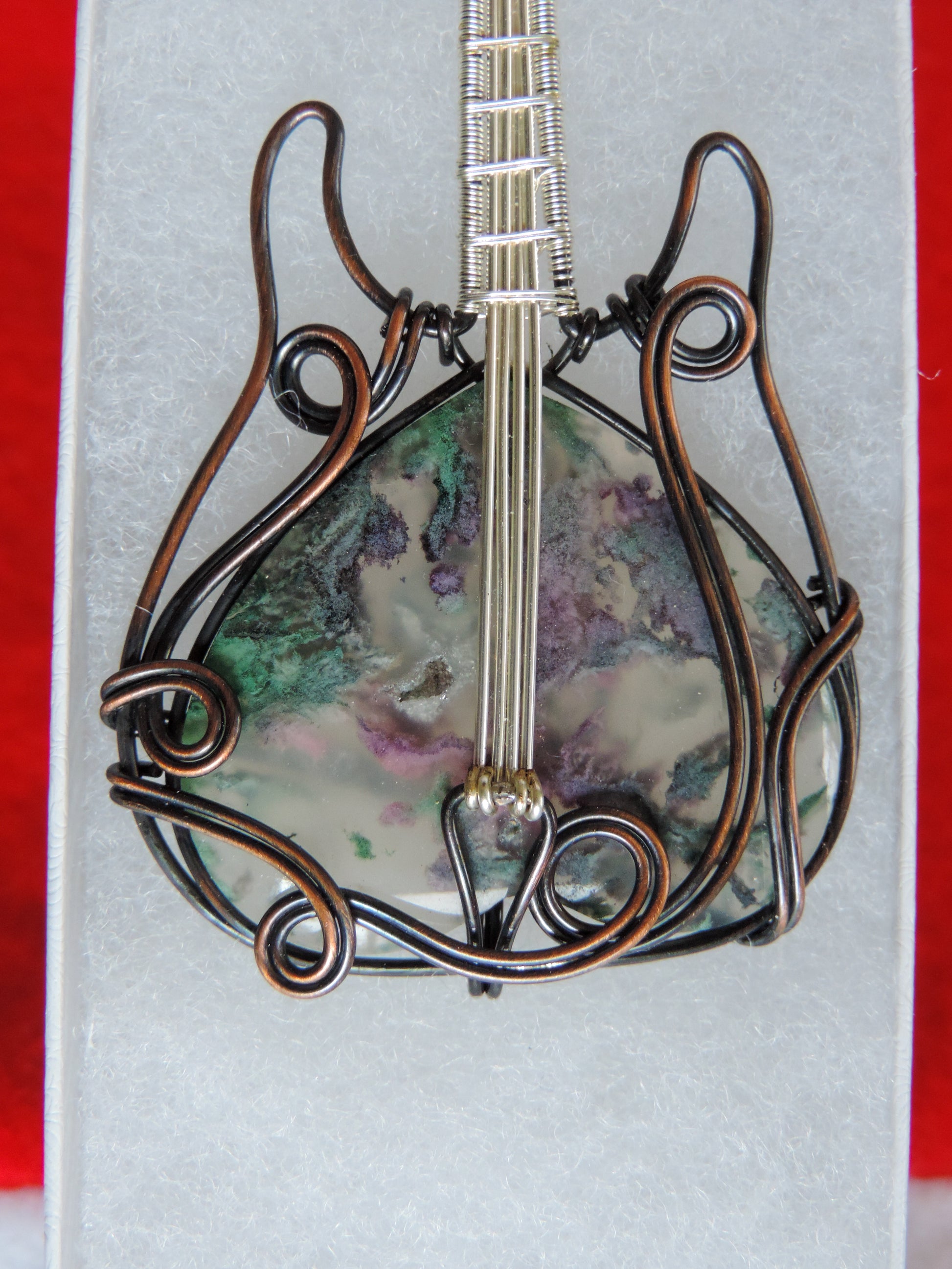 Moss Agate and Mixed Metals Guitar Pendant.  Moss Agate and Mixed Metals  One of a kind pendant that shows off your unique taste!