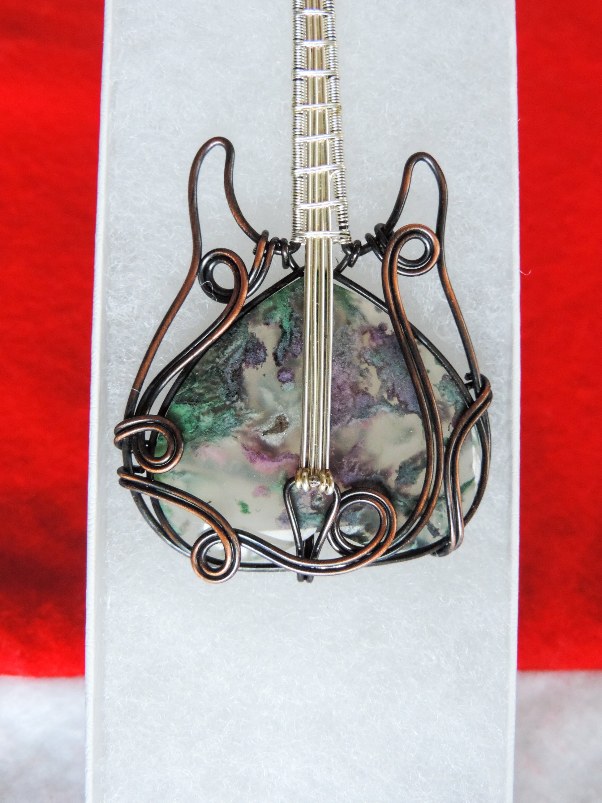 Moss Agate and Mixed Metals Guitar Pendant.  Moss Agate and Mixed Metals  One of a kind pendant that shows off your unique taste!