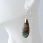 Extremely rare and lovely, Indonesian Blue Opalized Wood is a cherished material used by lapidary artists for creating stunning pieces of jewelry.  The material was first found as pebbles and rounded stones in streams and near the slopes of three volcanoes in the West Java Province. The bail and earring wires are authentic 925 sterling silver.  Feel treasured when you wear these earrings!