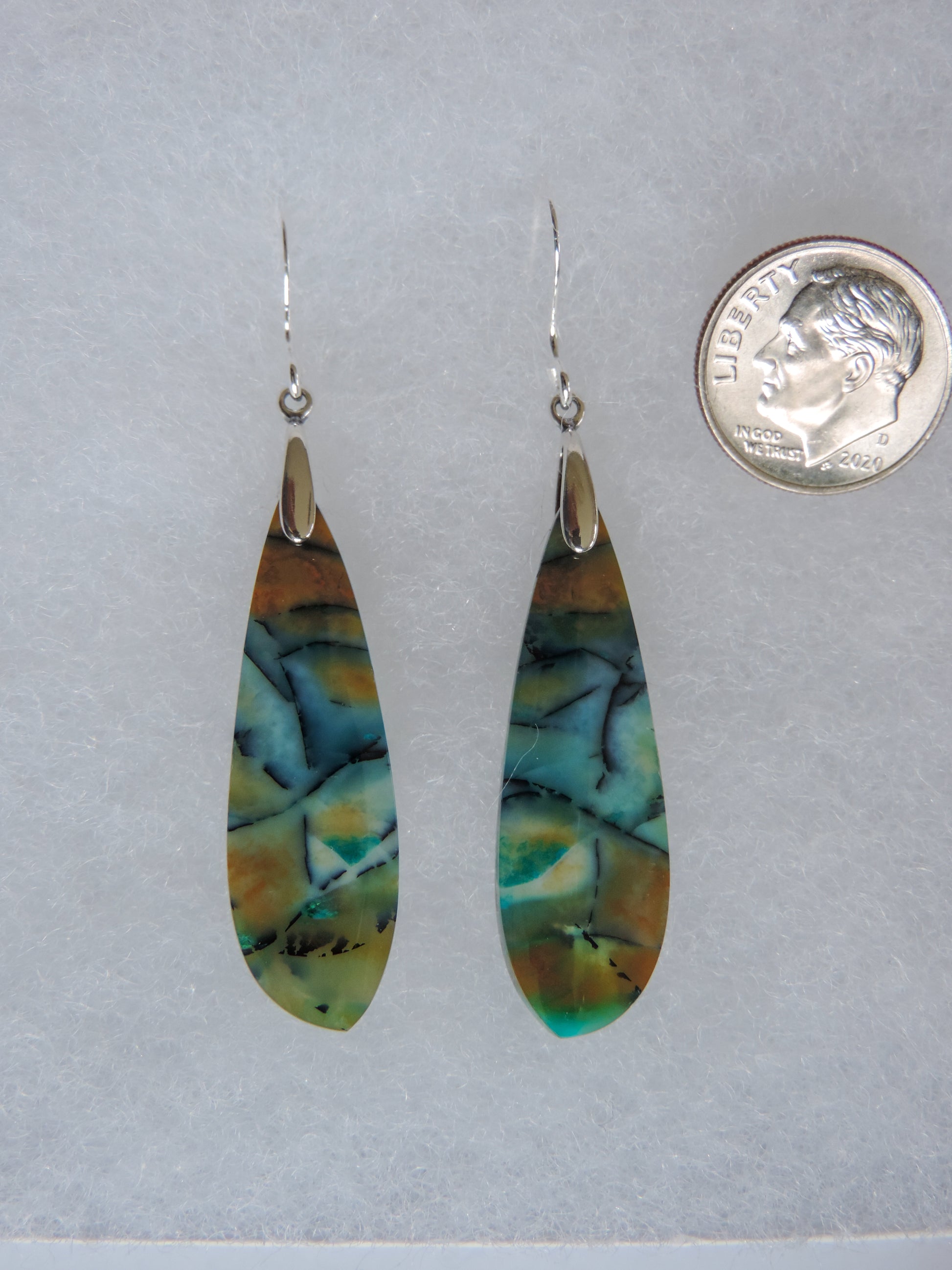 These rich minerals are responsible for the amazing colors in the stone.  The bail and earring wires are authentic 925 sterling silver.   This stone is a natural color