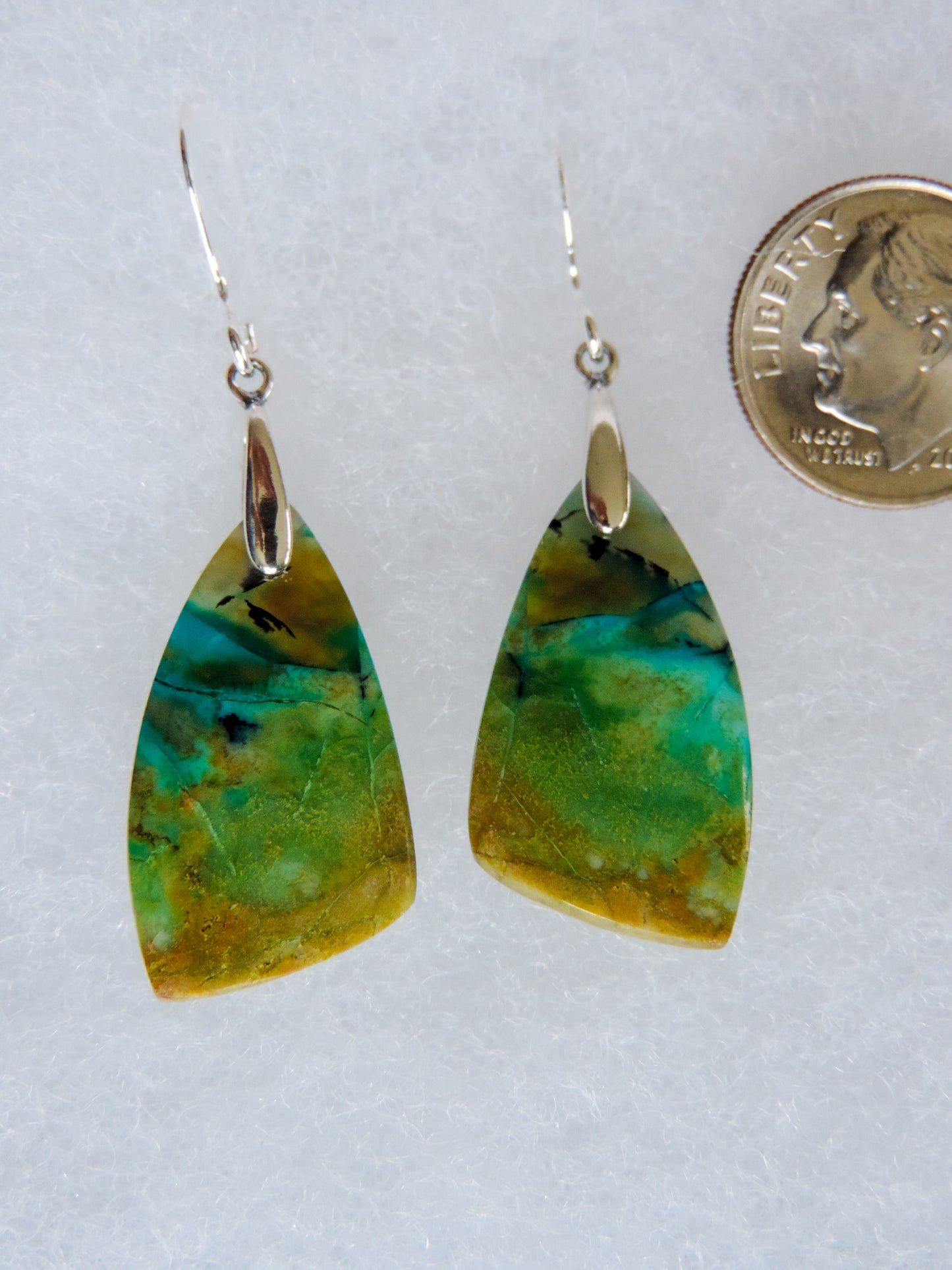 Your Indonesian Blue Opalized Wood Earrings will be shipped the same day in most cases, Monday through Friday.  Orders will be shipped first class USPS, which takes 3-4 days in the U.S. for delivery.