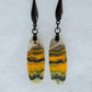 Bumblebee Jasper is named for its yellow, white, orange and black colored banding which resembles a common bumblebee.  This mineral was discovered in the Papandayan Volcano, West Java Province, Indonesia.  The gemstone is truly unique in appearance, fun to wear and is known spiritually for its uplifting, radiant energy. 