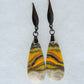 Bumblebee Jasper is named for its yellow, white, orange and black colored banding which resembles a common bumblebee.  This mineral was discovered in the Papandayan Volcano, West Java Province, Indonesia.  The gemstone is truly unique in appearance, fun to wear and is known spiritually for its uplifting, radiant energy.  