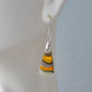 Bumblebee Jasper is named for its yellow, white, orange and black colored banding which resembles a common bumblebee.  This mineral was discovered in the Papandayan Volcano, West Java Province, Indonesia.  The gemstone is truly unique in appearance, fun to wear and is known spiritually for its uplifting, radiant energy.  Bee the buzz when you wear these fun earrings!  The bail and earring wire are authentic 925 sterling silver.