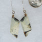 The bail and earring wires are authentic 925 sterling silver.  This stone is a natural color, no dyes or heat treatment have been used.  It was photographed without filters natural light; however, slight color variations may occur due to digitization. 