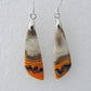 Bumblebee Jasper is named for its yellow, white, orange and black colored banding which resembles a common bumblebee.  This mineral was discovered in the Papandayan Volcano, West Java Province, Indonesia.  The gemstone is truly unique in appearance, fun to wear and is known spiritually for its uplifting, radiant energy.  Bee the buzz when you wear these fun earrings!  The bail and earring wire are authentic 925 sterling silver.