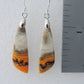 Bumblebee Jasper is named for its yellow, white, orange and black colored banding which resembles a common bumblebee.  This mineral was discovered in the Papandayan Volcano, West Java Province, Indonesia.  The gemstone is truly unique in appearance, fun to wear and is known spiritually for its uplifting, radiant energy.  Bee the buzz when you wear these fun earrings!  The bail and earring wire are authentic 925 sterling silver.