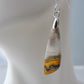 Bumblebee Jasper is named for its yellow, white, orange and black colored banding which resembles a common bumblebee.  This mineral was discovered in the Papandayan Volcano, West Java Province, Indonesia.  The gemstone is truly unique in appearance, fun to wear and is known spiritually for its uplifting, radiant energy.  Bee the buzz when you wear these fun earrings!  The bail and earring wire are authentic 925 sterling silver.