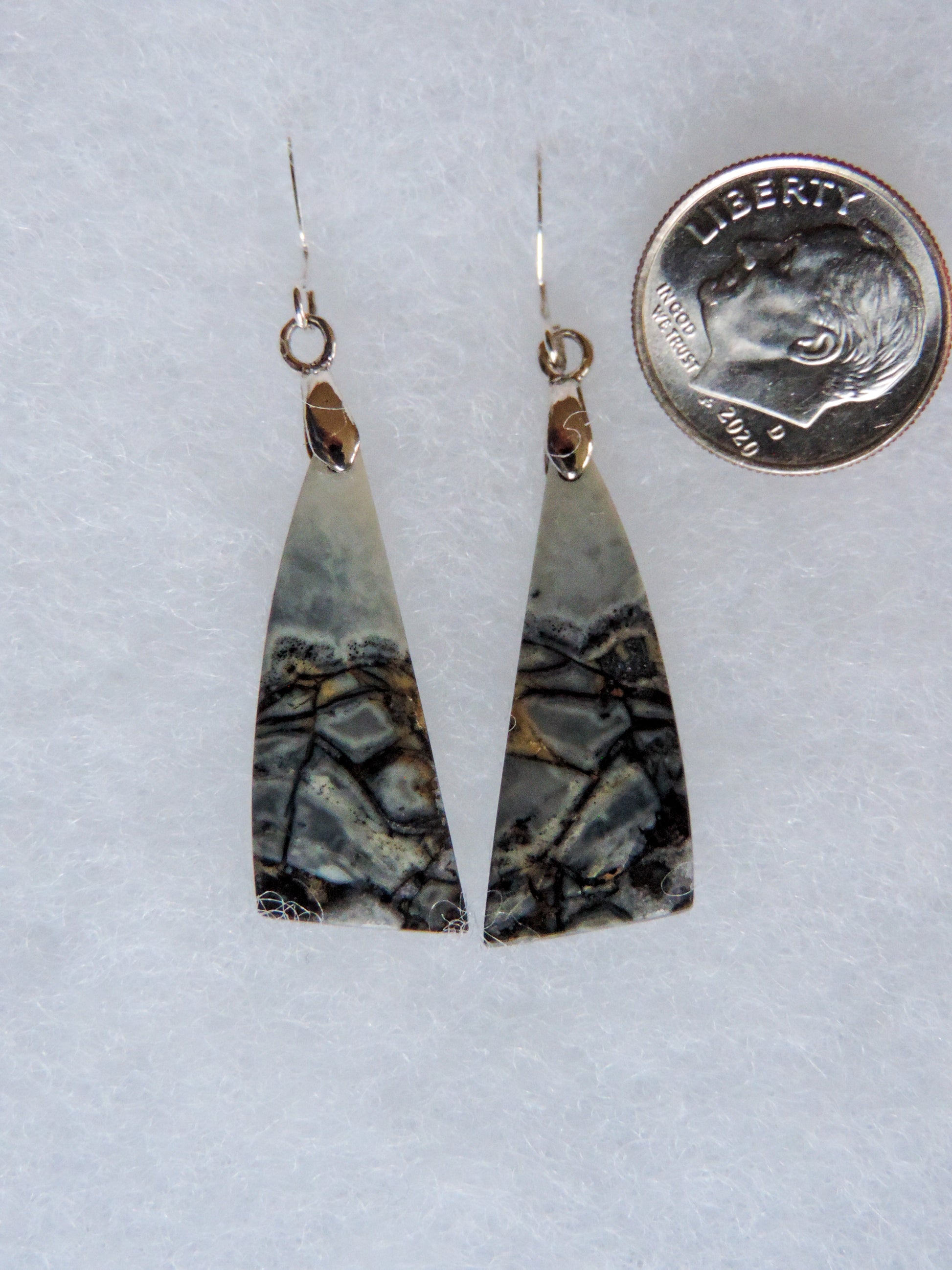 Found roughly ten years ago, this stone has made its way into the main stream market.  The bail and earring wires are authentic 925 sterling silver.