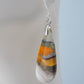 Bumblebee Jasper is named for its yellow, white, orange and black colored banding which resembles a common bumblebee.  This mineral was discovered in the Papandayan Volcano, West Java Province, Indonesia.  The gemstone is truly unique in appearance, fun to wear and is known spiritually for its uplifting, radiant energy.  Bee the buzz when you wear these fun earrings!  The bail and earring wire are authentic 925 sterling silver.