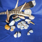 Yellowstone Country Treasure Sampler.  Natural earth items in this sampler package include:  1 antler, $36.99  2 polished petrified wood, $4.00  1 polished aventurine, $2.00  3 crystals, $1.50  10 assorted sizes polished madison blue agate, $20.00  2 rough petrified wood, $4.00  1 rough jasper, $2.00  2 rough madison blue agate, $2.00  2 madison blue agate key chains, $13.98  2 worry stones, $8.00  2 turkey feathers, $4.00  Total Value... $98.47  Holiday Sale Price - $58.99 (40% off