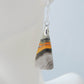 Bumblebee Jasper is named for its yellow, white, orange and black colored banding which resembles a common bumblebee.  This mineral was discovered in the Papandayan Volcano, West Java Province, Indonesia.  The gemstone is truly unique in appearance, fun to wear and is known spiritually for its uplifting, radiant energy.  Bee the buzz when you wear these fun earrings!  The bail and earring wire are authentic 925 sterling silver.