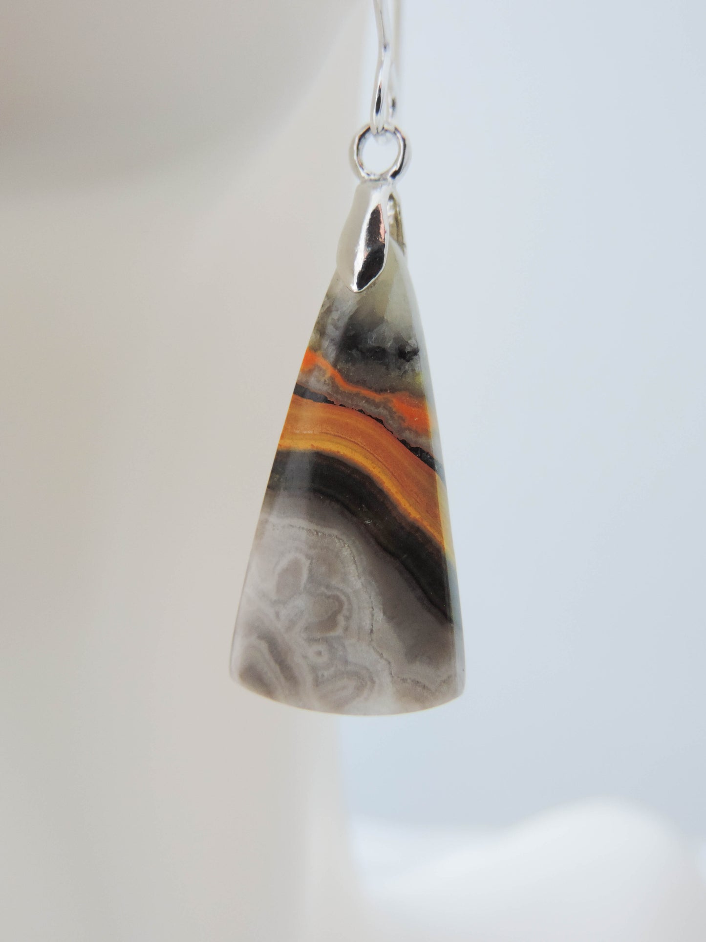 Bumblebee Jasper is named for its yellow, white, orange and black colored banding which resembles a common bumblebee.  This mineral was discovered in the Papandayan Volcano, West Java Province, Indonesia.  The gemstone is truly unique in appearance, fun to wear and is known spiritually for its uplifting, radiant energy.  Bee the buzz when you wear these fun earrings!  The bail and earring wire are authentic 925 sterling silver.