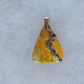 Bumblebee Jasper Pendant.  Bumblebee Jasper is named for its yellow, white, orange and black colored banding which resembles a common bumblebee.  This mineral was discovered in the Papandayan Volcano, West Java Province, Indonesia.  The gemstone is truly unique in appearance, fun to wear and is known spiritually for its uplifting, radiant energy.   Bee the buzz when you wear this fun pendant!