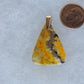 The pendant bail is authentic 925 sterling silver.  This stone is a natural color, no dyes or heat treatment have been used.  It was photographed without filters in natural light; however, slight color variations may occur due to digitization