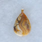 Brown Lace Agate Pendant.  Indonesian Agates exhibit a wide variety of colors and amazing complexity.  No two agates are exactly alike, each one being a unique and beautiful creation!  Agates with multiple bands of color are known as fortification agates, those with dendritic or moss looking inclusions are referred to as moss agate and many others are given descriptive names relative to their appearance or where they are found.  The