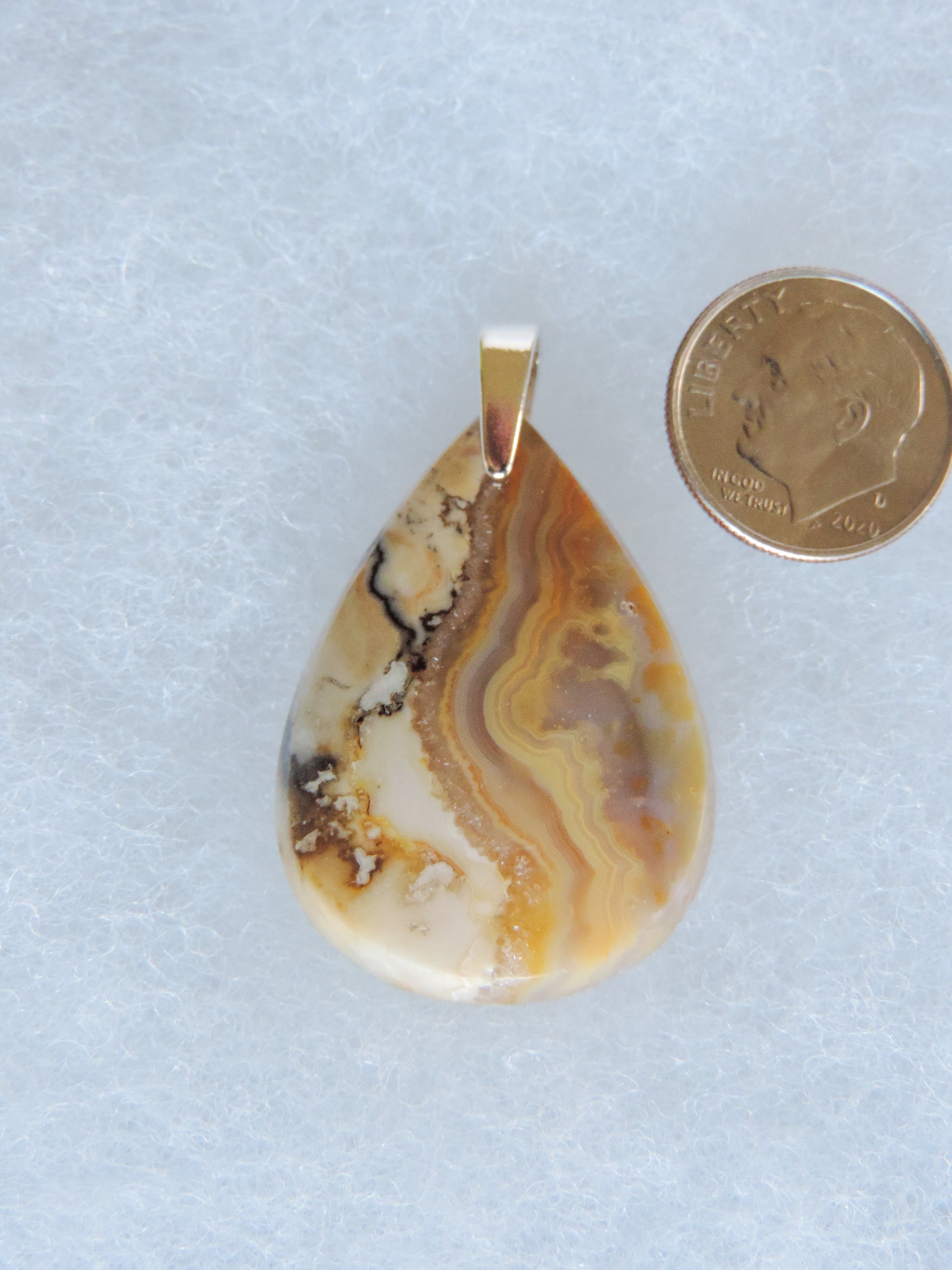 Find your perfect Indonesian Agate on our store!  The pendant bail is authentic 925 sterling silver.