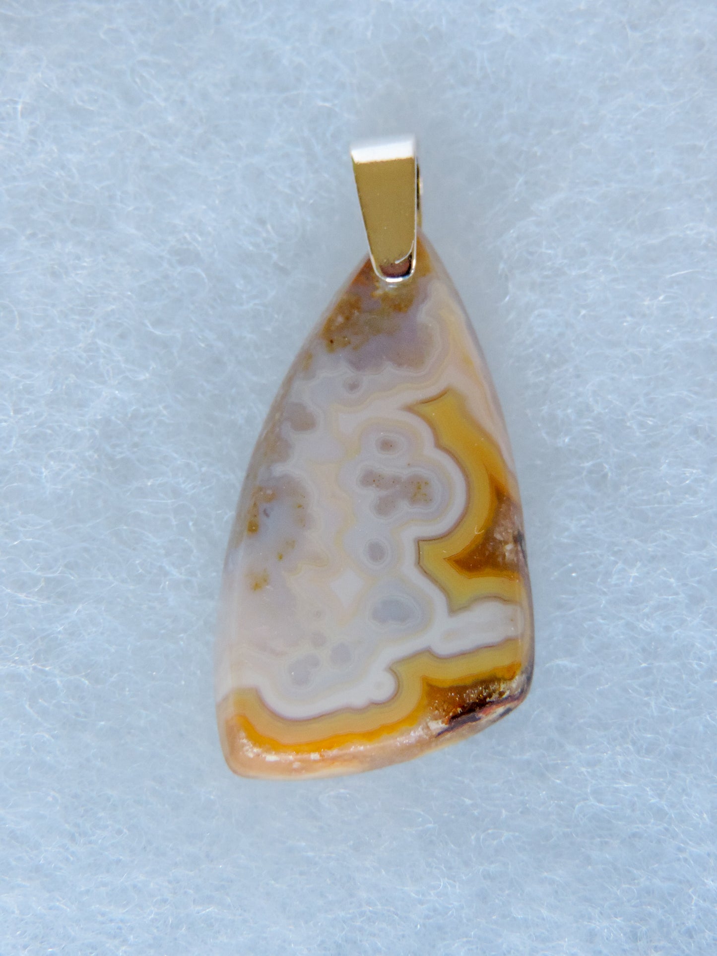 Find your perfect Indonesian Agate on our store!  The pendant bail is authentic 925 sterling silver.