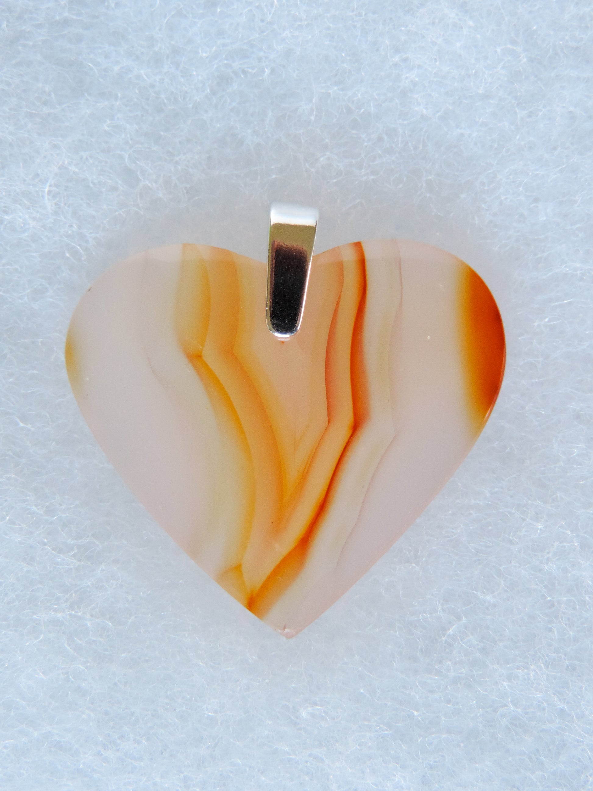 Carnelian Agate Pendant.  Indonesian Agates exhibit a wide variety of colors and amazing complexity.  No two agates are exactly alike, each one being a unique and beautiful creation!  