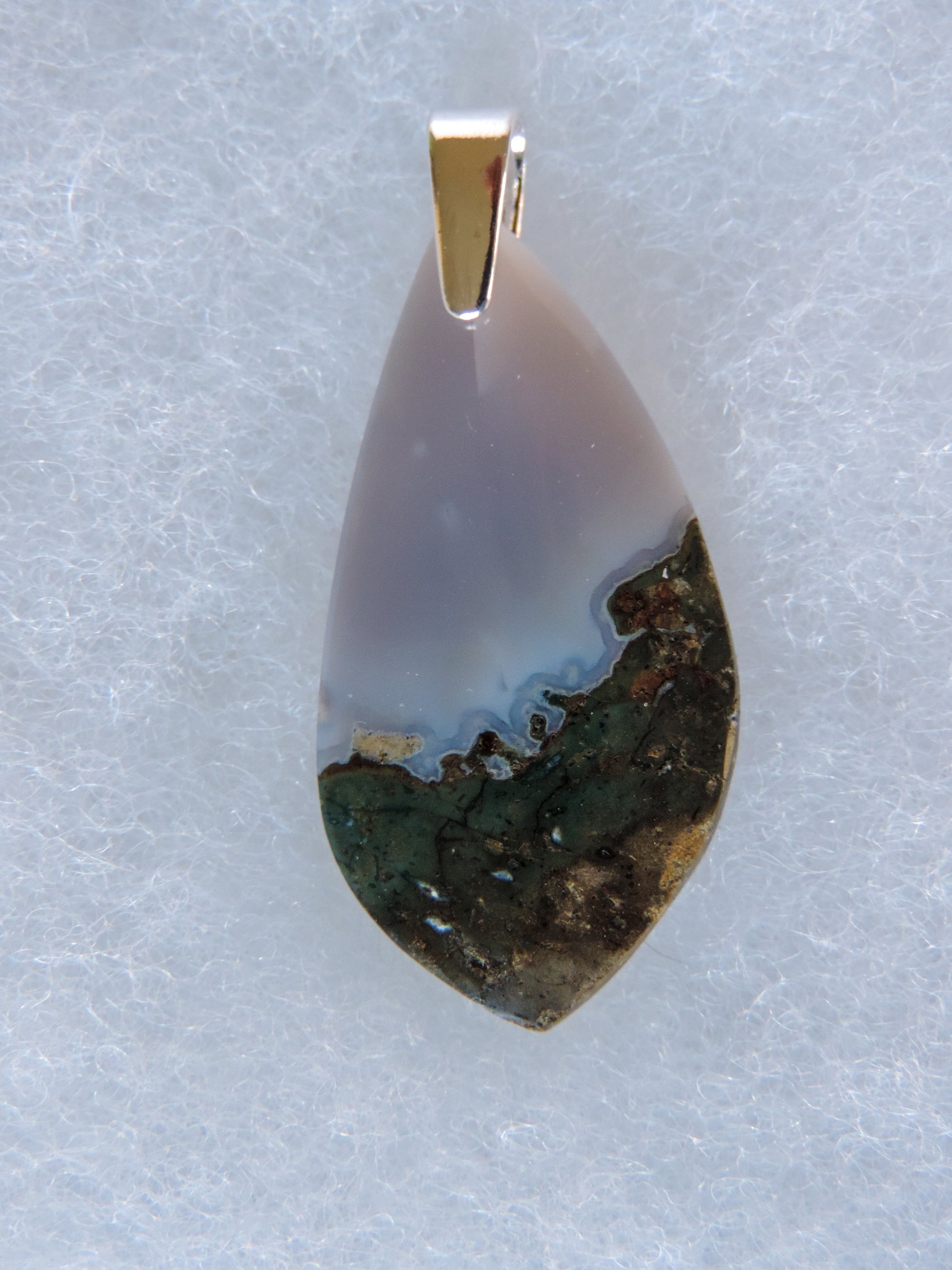 Find your perfect Indonesian Agate on our store!  The pendant bail is authentic 925 sterling silver.