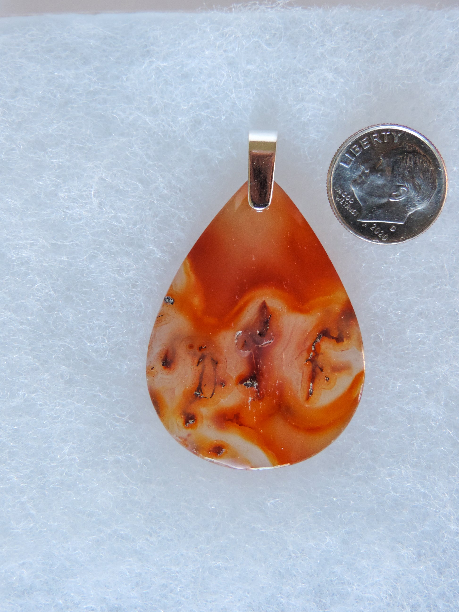 Find your perfect Indonesian Agate on our store!  The pendant bail is authentic 925 sterling silver.