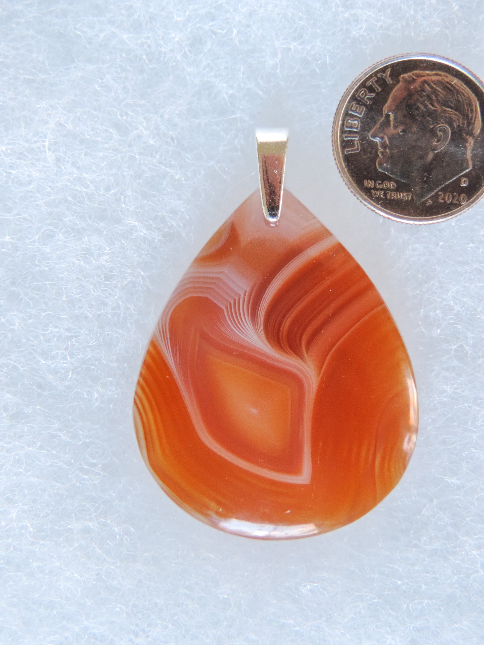 The diversity and complexity of Indonesian agates suggests their genesis occurred over great geological time periods during which a variety of formation conditions existed.  Find your perfect Indonesian Agate on our store!  The pendant bail is authentic 925 sterling silver.