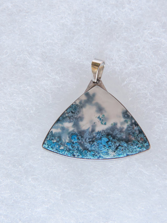 Moss Agate Pendant.  Indonesian Agates exhibit a wide variety of colors and amazing complexity.  No two agates are exactly alike, each one being a unique and beautiful creation!  Agates with multiple bands of color are known as fortification agates, those with dendritic or moss looking inclusions are referred to as moss agate and many others are given descriptive names relative to their appearance or where they are found.