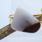 The translucent blue agate and its spectacular color variations have an alluring effect, many people find the stone naturally relaxing.  Original and unique in design, each piece is hand crafted by lapidary artists in Montana.      Our hand crafted jewelry is photographed next to a ruler for size.  This stone is a natural color, no dyes or heat treatment have been used.