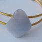The translucent blue agate and its spectacular color variations have an alluring effect, many people find the stone naturally relaxing.  Original and unique in design, each piece is hand crafted by lapidary artists in Montana.      Our hand crafted jewelry is photographed next to a ruler for size.  This stone is a natural color, no dyes or heat treatment have been used.