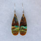 These rich minerals are responsible for the amazing colors in the stone.  The bail and earring wires are authentic 925 sterling silver.