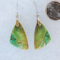 Over thousands of years, the woods’ organic material was replaced with opaline silica rich in copper, iron and manganese minerals.  These rich minerals are responsible for the amazing colors in the stone.  The bail and earring wires are authentic 925 sterling silver. 