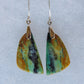 This stone is a natural color, no dyes or heat treatment have been used.  It was photographed without filters in natural light; however, slight color variations may occur due to digitization.  Natural stones can have nooks and crannies, inclusions or small cracks, these distinguishing features lend character to the piece.