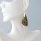 The bail and earring wires are authentic 925 sterling silver.  Feel treasured when you wear these earrings! Extremely rare and lovely, Indonesian Blue Opalized Wood is a cherished material used by lapidary artists for creating stunning pieces of jewelry.  The material was first found as pebbles and rounded stones in streams and near the slopes of three volcanoes in the West Java Province. 