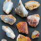 Madison Blue Agate bundle.   Known as the Treasure State, Montana’s landscape is an abundant resource for precious and semi-precious stones.  One of the semi-precious stones, Madison Blue Agate, is featured in this group.  This rare stone is hand collected on private land in the mountains of Montana.  These natural unrefined stones can have nooks and crannies, inclusions, or small cracks, these distinguishing features lend character to the piece.