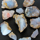 Madison Blue Agate bundle.   Known as the Treasure State, Montana’s landscape is an abundant resource for precious and semi-precious stones.  One of the semi-precious stones, Madison Blue Agate, is featured in this group.  This rare stone is hand collected on private land in the mountains of Montana.  These natural unrefined stones can have nooks and crannies, inclusions, or small cracks, these distinguishing features lend character to the piece.