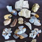 Yellowstone Country Treasure Sampler.  Natural earth items in this sampler package include:  1 large petrified wood, $19.75  1 medium petrified/agatized wood, $15.75  1 medium crystal rock specimen, beautiful, $19.99  3 polished petrified wood (medium) $15  2 polished petrified wood (small) $10  1 XL madison blue agate (rough) $9  1 XL madison blue agate (polished) $9  5 large madison blue agate (polished) $10.99
