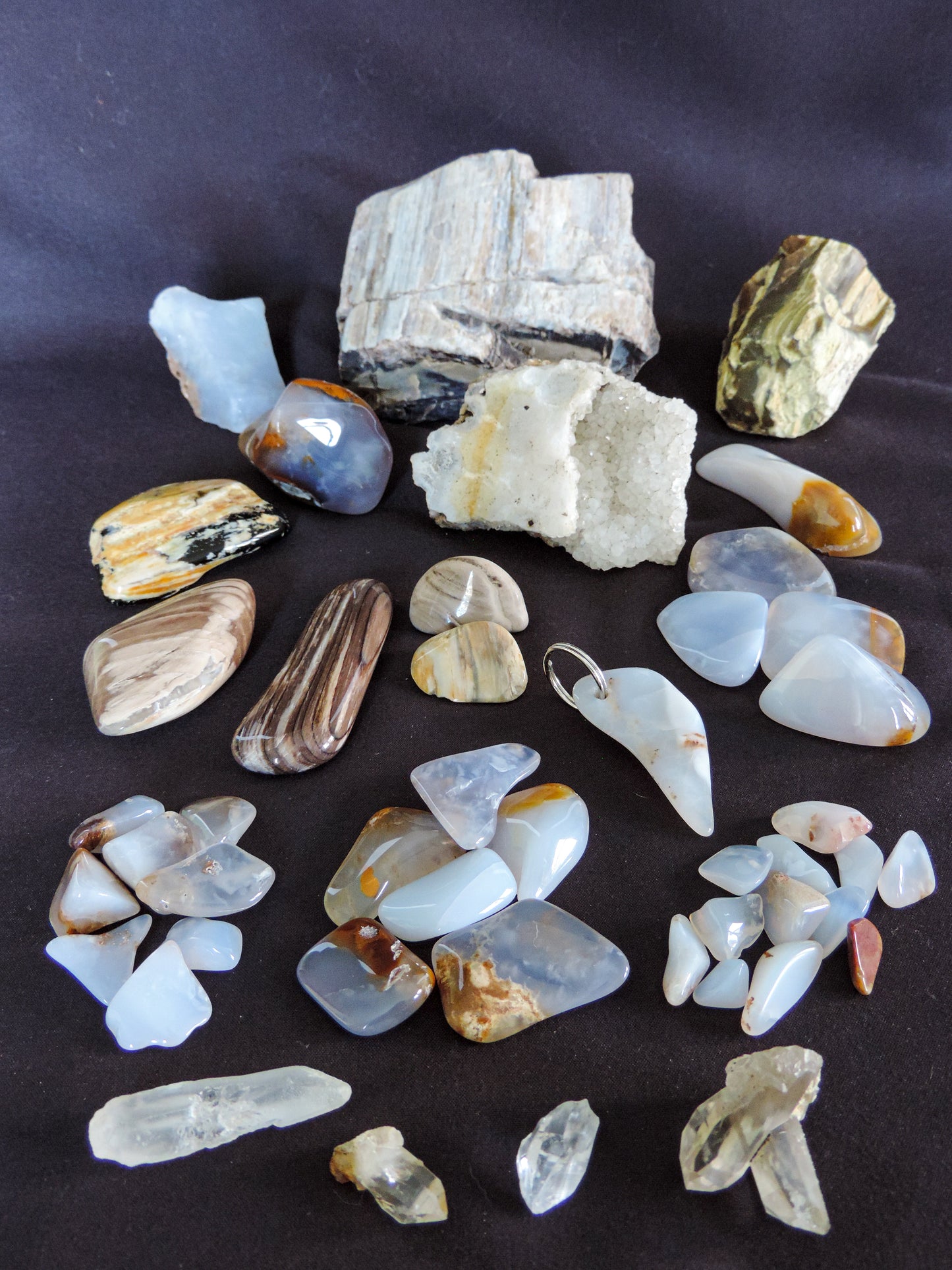 Yellowstone Country Treasure Sampler.  Natural earth items in this sampler package include:  1 large petrified wood, $19.75  1 medium petrified/agatized wood, $15.75  1 medium crystal rock specimen, beautiful, $19.99  3 polished petrified wood (medium) $15  2 polished petrified wood (small) $10  1 XL madison blue agate (rough) $9  1 XL madison blue agate (polished) $9  5 large madison blue agate (polished) $10.99