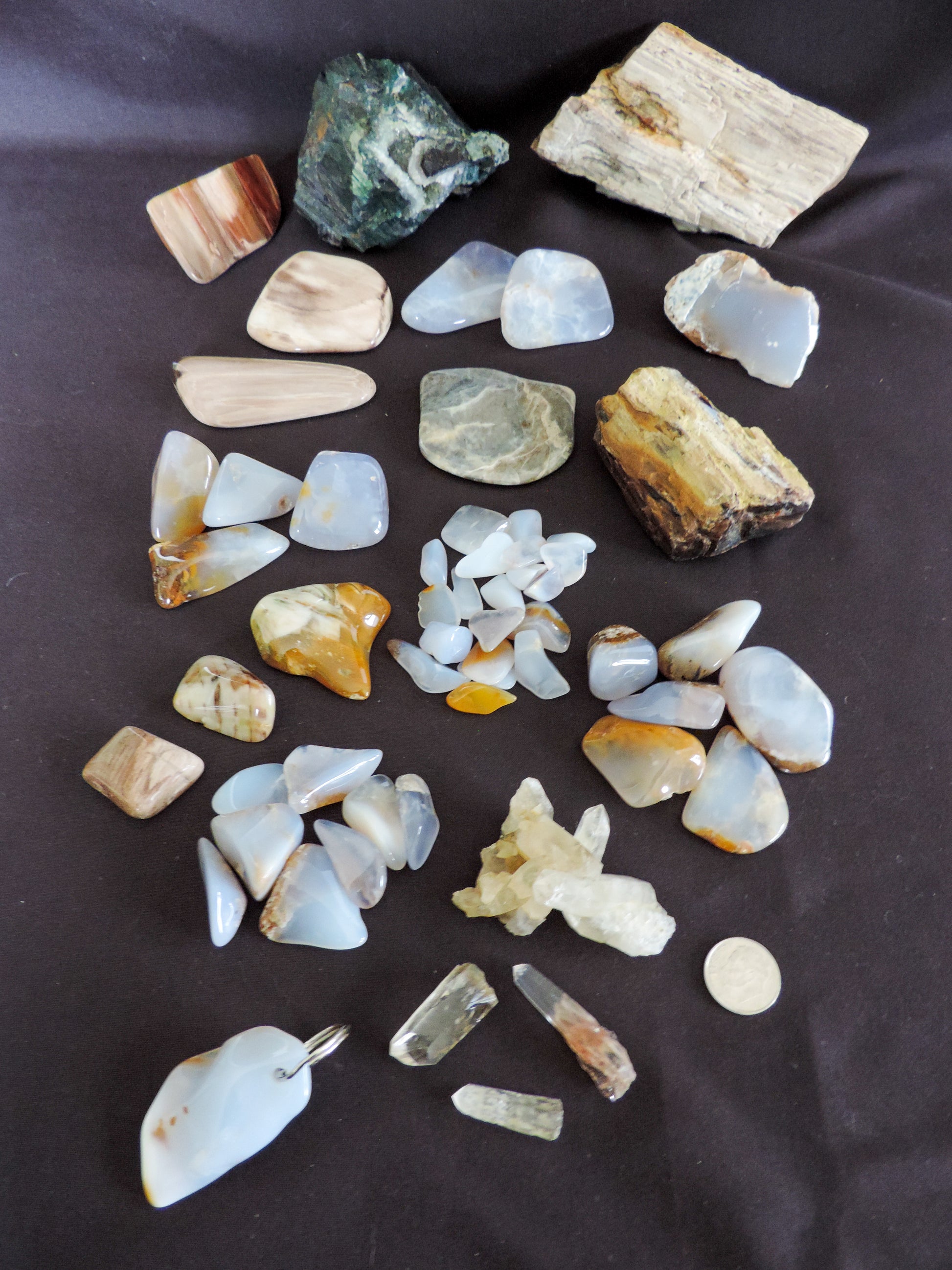 Yellowstone Country Treasure Sampler.  Natural earth items in this sampler package include:  1 large black agatized wood with really nice crystal pocket, $32  1 large petrified wood (rough) $19.75  1 medium petrified/agatized wood (rough) $15.75  2 polished petrified wood (medium) $10.99  3 polished petrified wood (small) $10.99  1 medium madison blue agate, high quality (rough) $7  1 polished agate slab, $5  1