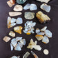 Yellowstone Country Treasure Sampler.  Natural earth items in this sampler package include:  1 large black agatized wood with really nice crystal pocket, $32  1 large petrified wood (rough) $19.75  1 medium petrified/agatized wood (rough) $15.75